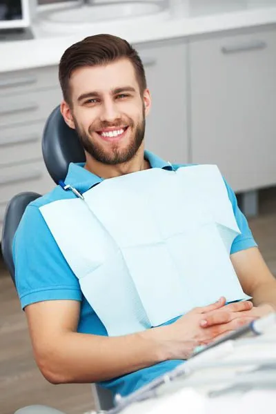man smiling during his visit to Fioritto Family Dental